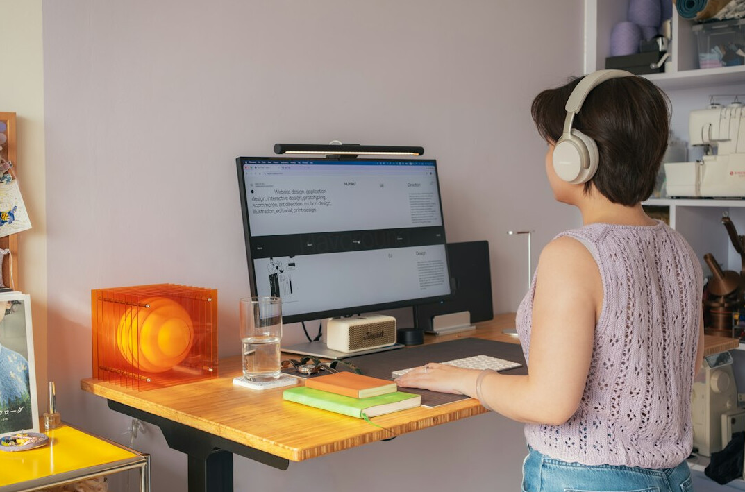 woman coding at desk