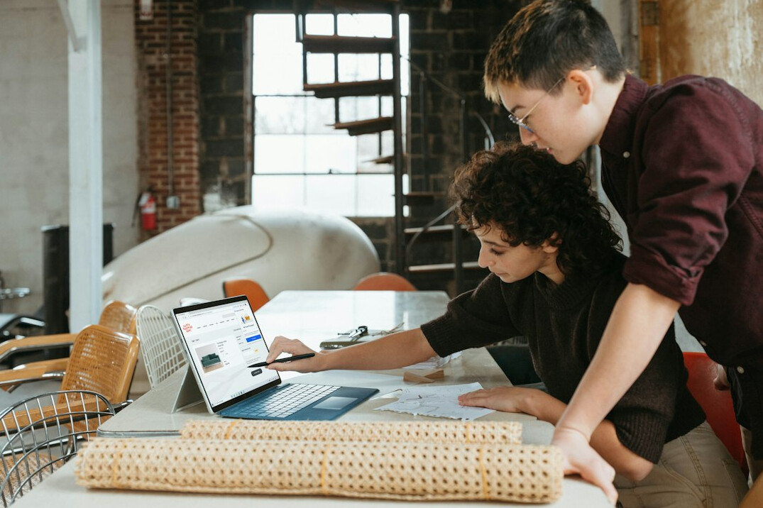kids working together on laptop