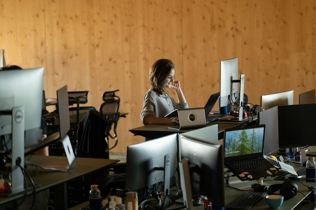 woman working on code at desk